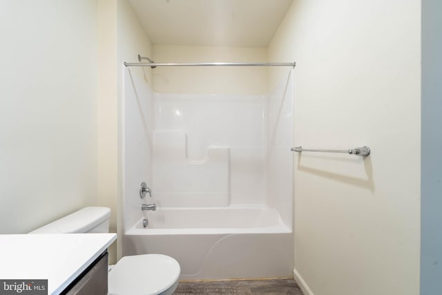 full bath featuring toilet, vanity, and bathtub / shower combination