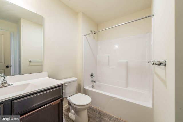 full bath with tub / shower combination, toilet, and vanity