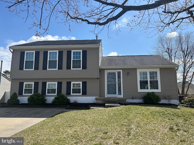 split level home with a front yard