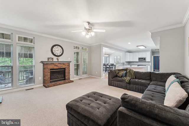 living area featuring light colored carpet, baseboards, ceiling fan, and ornamental molding
