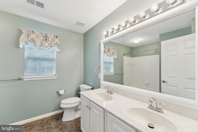 bathroom featuring a sink, toilet, baseboards, and visible vents