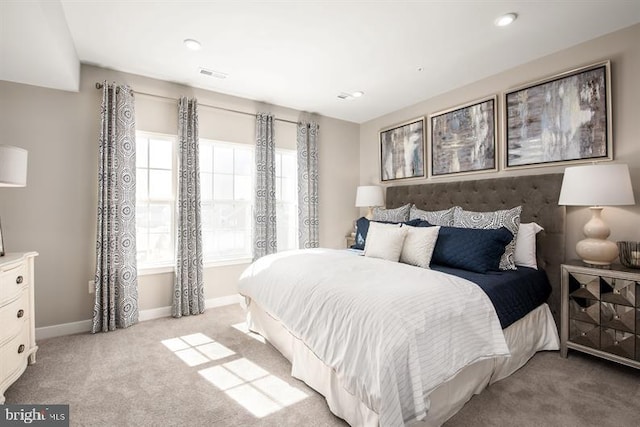 bedroom with recessed lighting, visible vents, light carpet, and baseboards