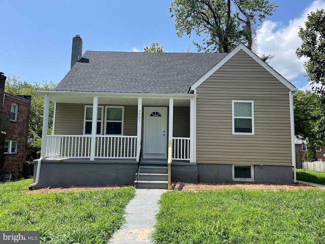 3801 Parkside Dr, Baltimore, MD 21206 - bungalow-style home featuring covered porch, a front yard, a shingled roof, and a chimney
