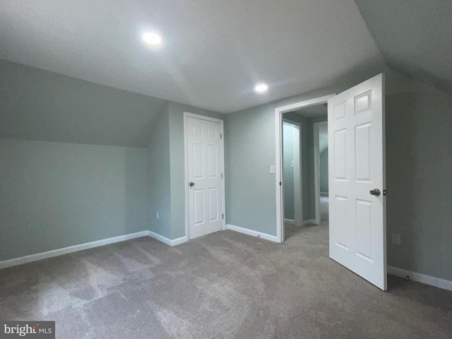 3801 Parkside Dr, Baltimore, MD 21206 - additional living space featuring carpet floors, baseboards, and vaulted ceiling