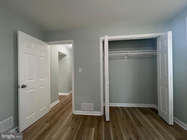 3801 Parkside Dr, Baltimore, MD 21206 - unfurnished bedroom with baseboards, visible vents, and wood finished floors