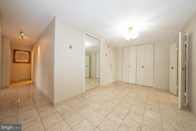 50 Belmont Ave Unit 1010, Bala Cynwyd, PA 19004 - unfurnished bedroom featuring light tile patterned flooring and a closet