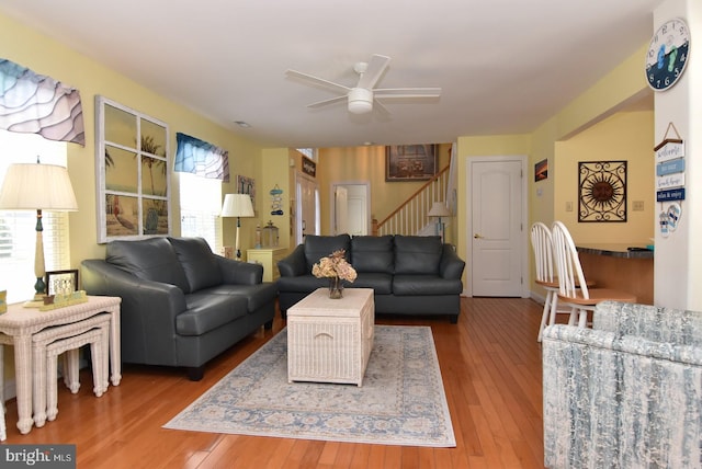 20324 Mallory Ct Unit 49, Rehoboth Beach, DE 19971 - living room featuring stairs, ceiling fan, and hardwood / wood-style floors