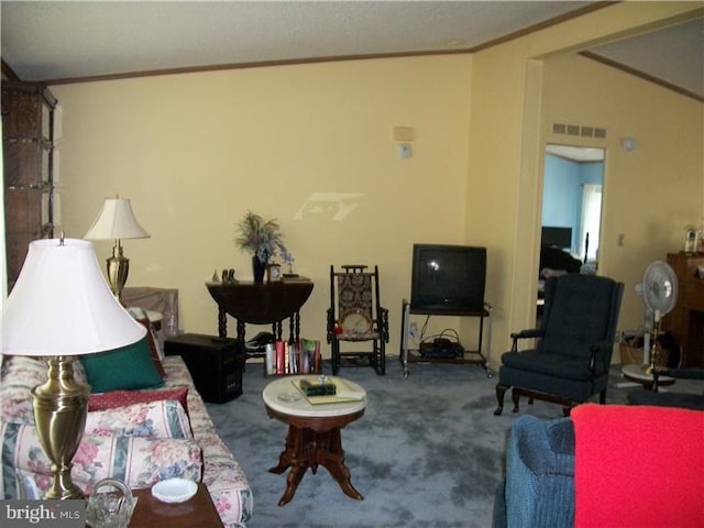 carpeted living area with visible vents and ornamental molding