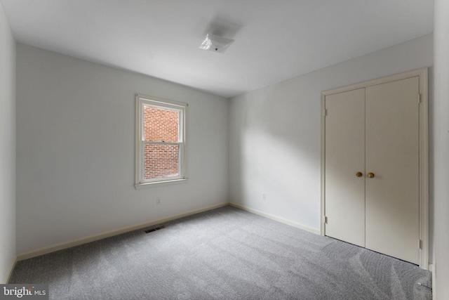 22 E Howell Ave, Alexandria, VA 22301 - unfurnished bedroom with carpet flooring, baseboards, and a closet