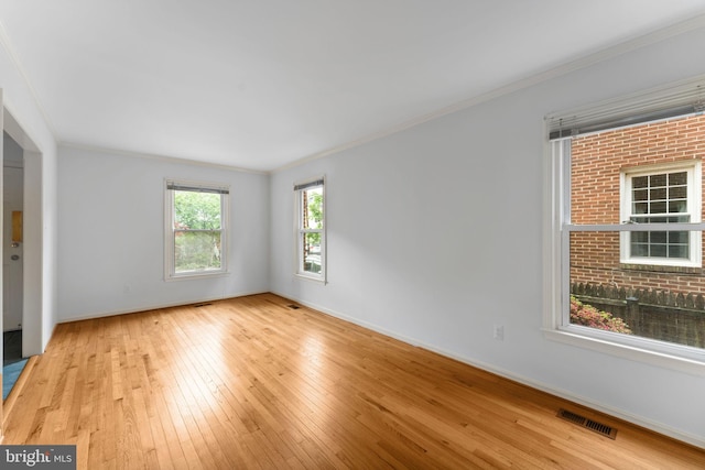 22 E Howell Ave, Alexandria, VA 22301 - empty room featuring wood-type flooring, crown molding, and baseboards