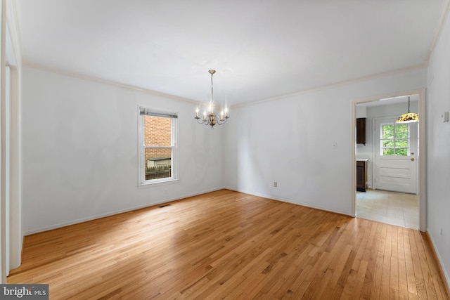 22 E Howell Ave, Alexandria, VA 22301 - empty room featuring a chandelier, ornamental molding, light wood-style flooring, and baseboards