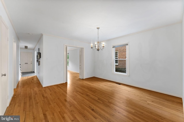 22 E Howell Ave, Alexandria, VA 22301 - unfurnished dining area with a chandelier, crown molding, light wood-type flooring, and baseboards