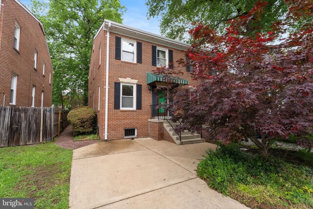 22 E Howell Ave, Alexandria, VA 22301 - view of front of property with fence and brick siding