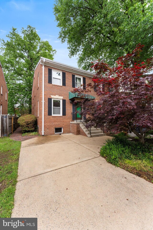 22 E Howell Ave, Alexandria, VA 22301 - view of front of property with brick siding and fence