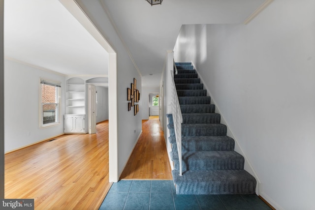22 E Howell Ave, Alexandria, VA 22301 - stairway with arched walkways, healthy amount of natural light, ornamental molding, wood finished floors, and built in features