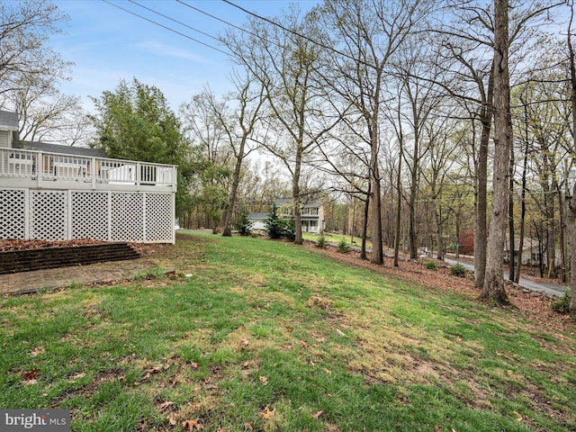 view of yard featuring a deck