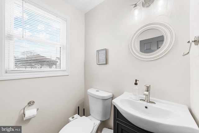 bathroom with toilet and vanity