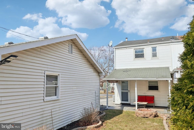 back of property with a yard