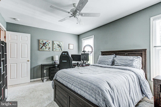 bedroom with carpet floors, baseboards, and a ceiling fan