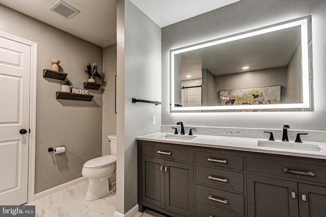bathroom with a sink, visible vents, toilet, and marble finish floor