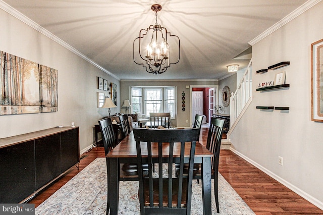 dining area featuring crown molding, baseboards, a chandelier, and dark wood-type flooring