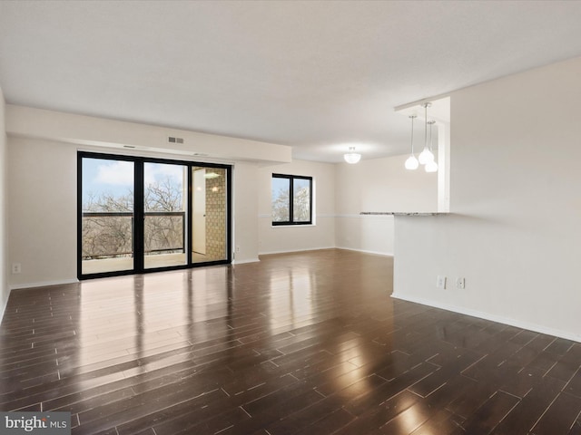 309 Yoakum Pkwy Unit 1003, Alexandria, VA 22304 - unfurnished room featuring baseboards, visible vents, and wood finished floors