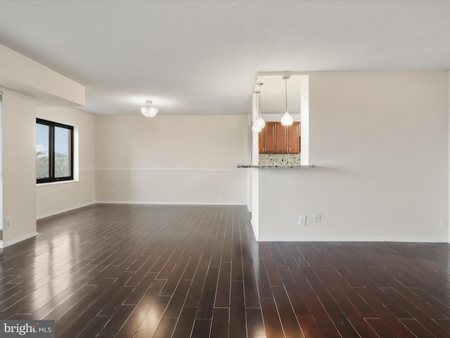 309 Yoakum Pkwy Unit 1003, Alexandria, VA 22304 - unfurnished room with baseboards and dark wood-style flooring