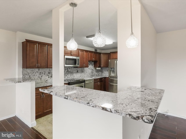 309 Yoakum Pkwy Unit 1003, Alexandria, VA 22304 - kitchen featuring a peninsula, stainless steel appliances, light stone countertops, and decorative backsplash