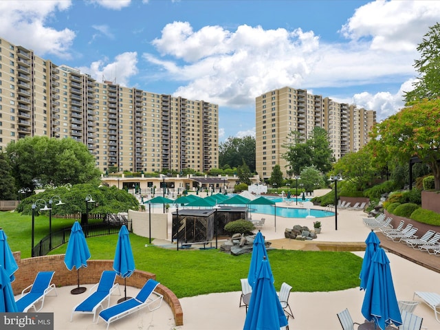 309 Yoakum Pkwy Unit 1003, Alexandria, VA 22304 - community pool featuring a patio, fence, and a yard