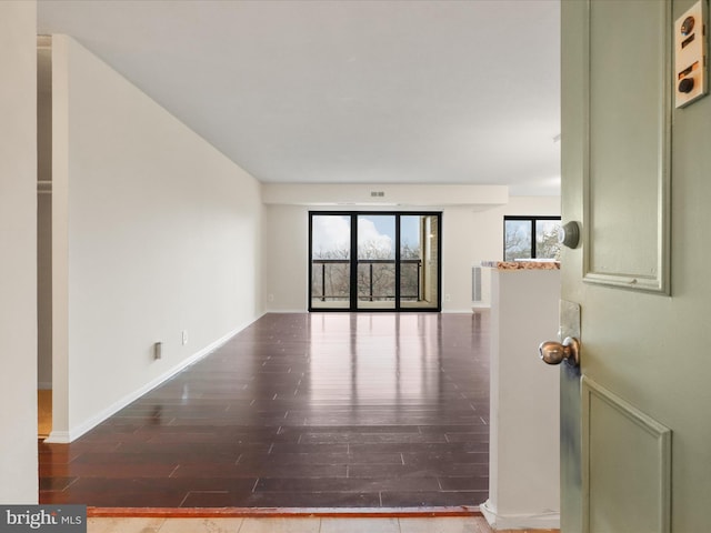309 Yoakum Pkwy Unit 1003, Alexandria, VA 22304 - empty room with baseboards and wood finished floors