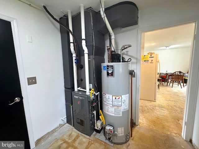 utility room featuring water heater