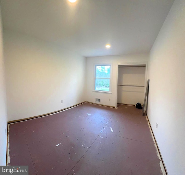 unfurnished bedroom featuring visible vents