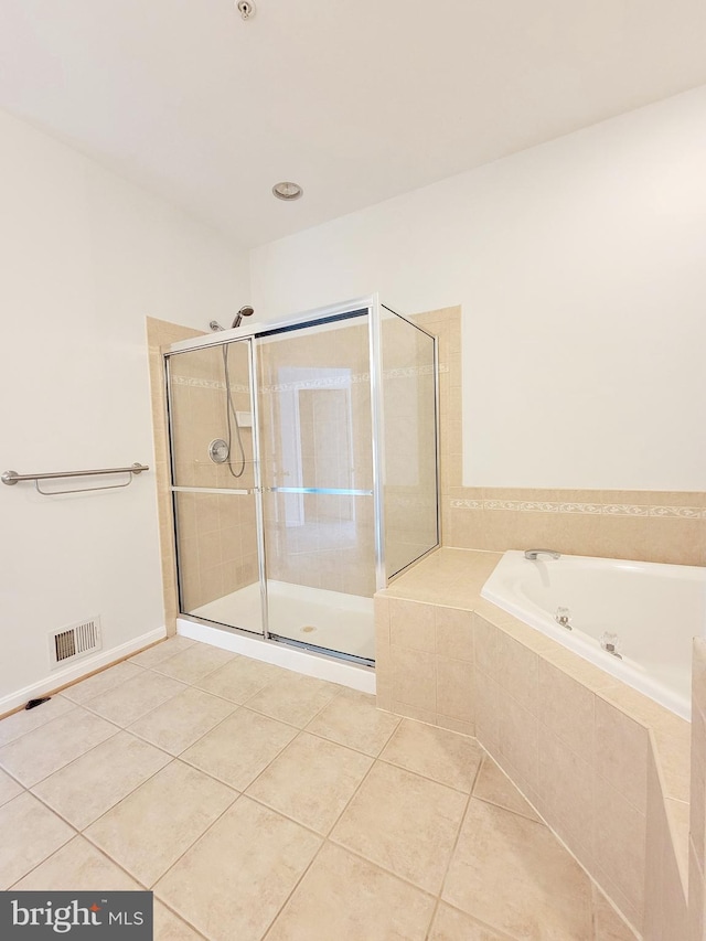 bathroom with a shower stall, tile patterned floors, visible vents, and a bath