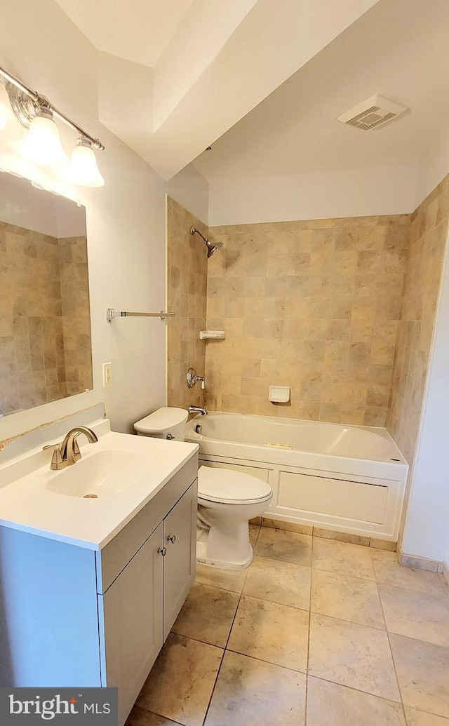 bathroom featuring tile patterned flooring, vanity, toilet, visible vents, and washtub / shower combination