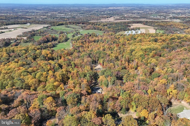 drone / aerial view with a view of trees