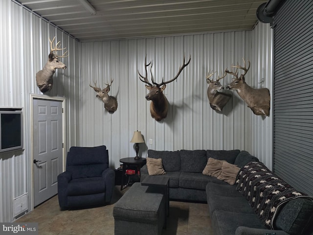 living room with metal wall