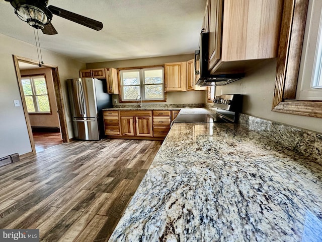 18928 National Pike, Frostburg, MD 21532 - kitchen featuring baseboards, dark wood-style flooring, light brown cabinetry, ceiling fan, and appliances with stainless steel finishes