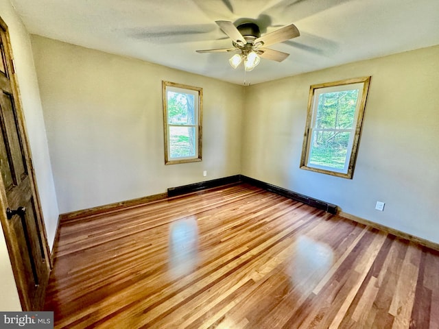 18928 National Pike, Frostburg, MD 21532 - spare room with baseboards, plenty of natural light, wood finished floors, and a ceiling fan