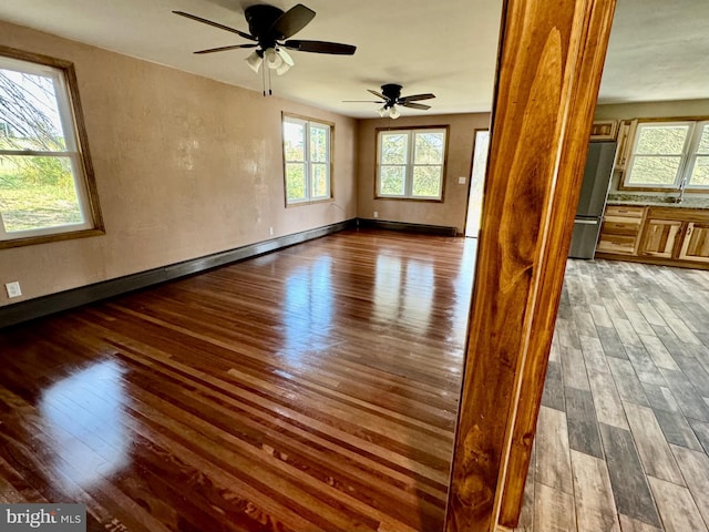 18928 National Pike, Frostburg, MD 21532 - spare room with a ceiling fan, a sink, wood finished floors, baseboards, and a textured wall