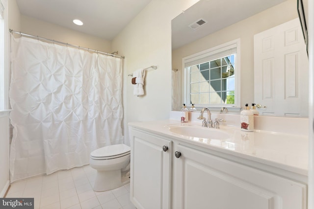 bathroom with curtained shower, visible vents, toilet, tile patterned floors, and vanity