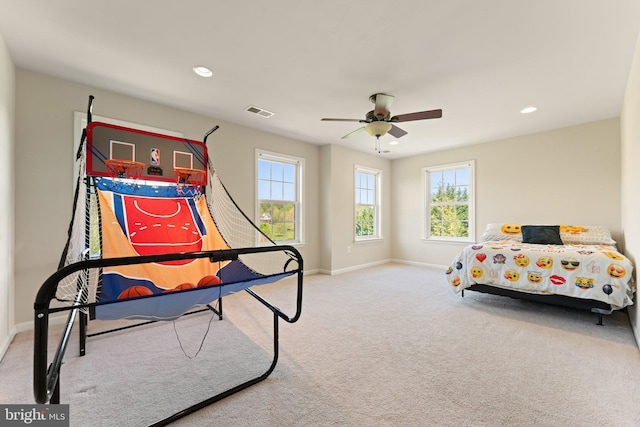 bedroom featuring baseboards, visible vents, a ceiling fan, and carpet floors