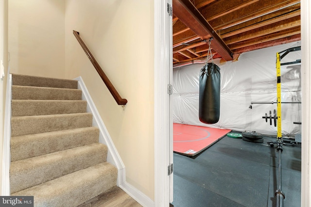 staircase featuring baseboards