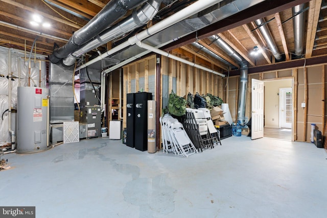 unfinished basement featuring heating unit and electric water heater
