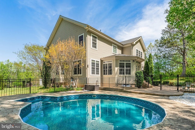 view of swimming pool featuring fence, a patio, and a fenced in pool