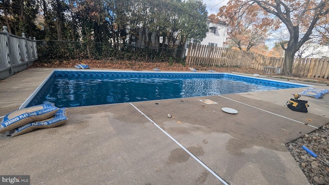 view of pool with a fenced in pool, a fenced backyard, and a patio area