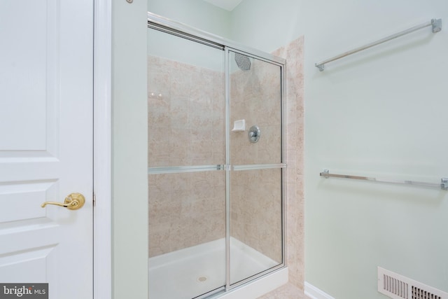 full bath with visible vents and a stall shower