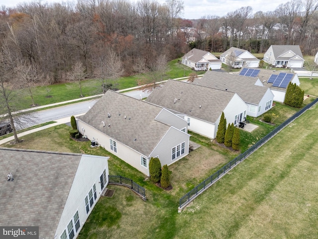 birds eye view of property with a residential view