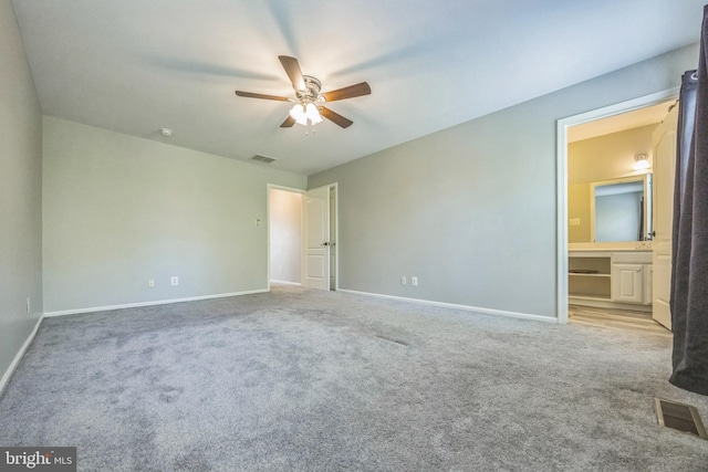 unfurnished bedroom with visible vents, baseboards, and light carpet