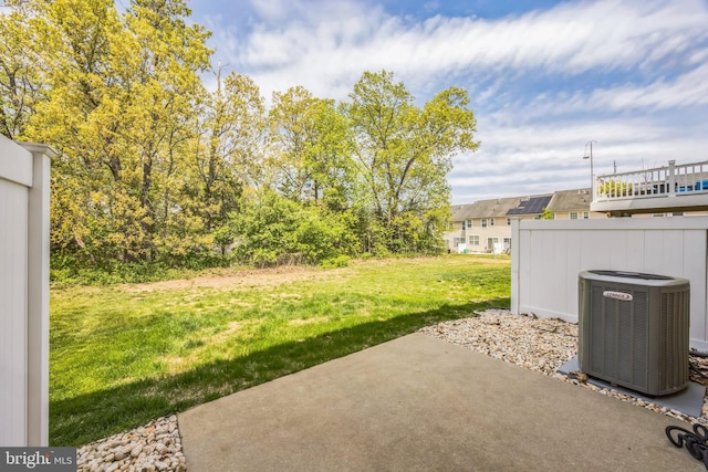 view of yard with a patio and central AC unit