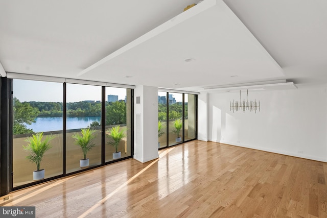 2700 Virginia Ave NW Unit 811, Washington, DC 20037 - spare room with expansive windows, wood finished floors, and a water view